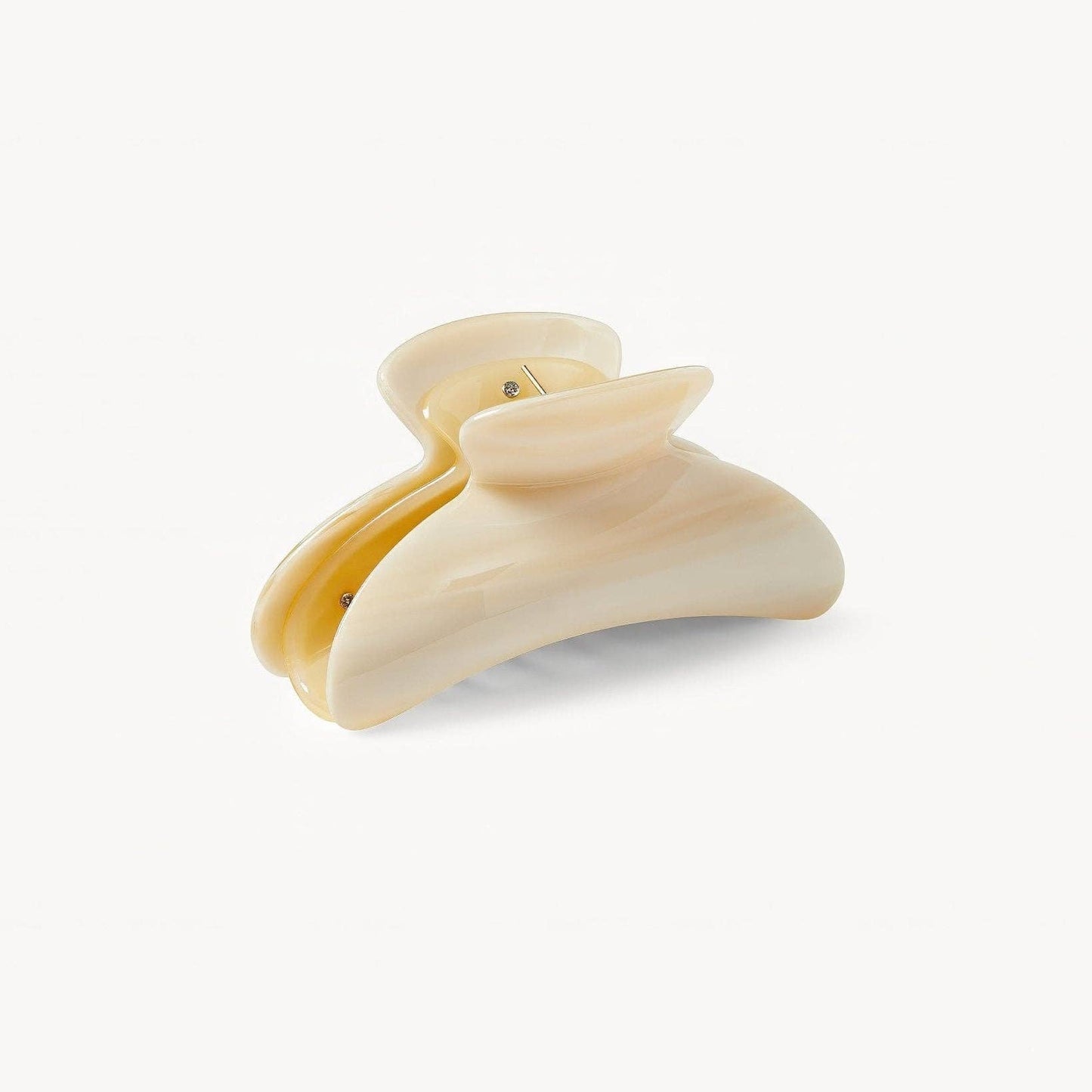 Beige hair clip on a white background