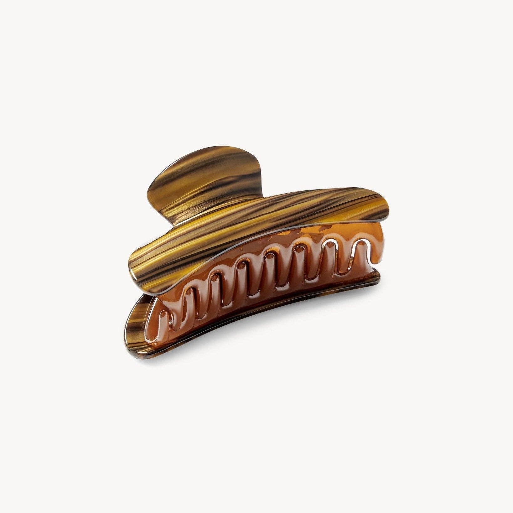 Tortoiseshell patterned hair clip on a white background