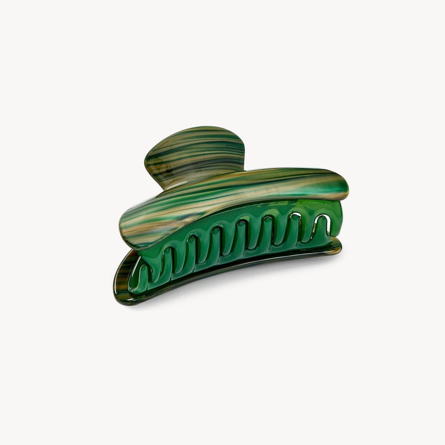 Green hair clip on a white background