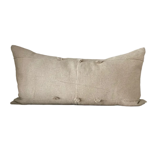 Natural colored lumbar pillow on a white background