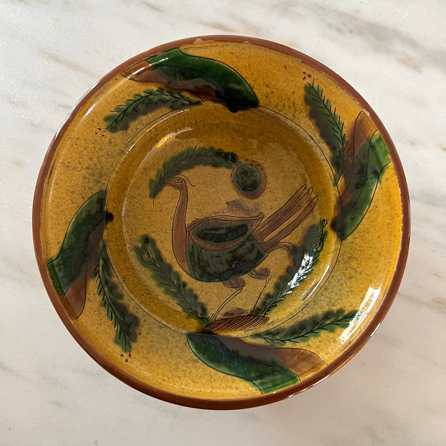 Vintage earthenware bowl with a bird motif