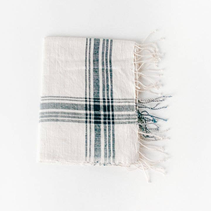 Plaid towel with white and blue stripes on a white background