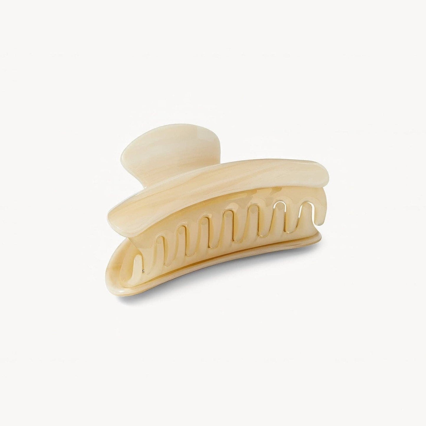 Beige hair clip on a white background
