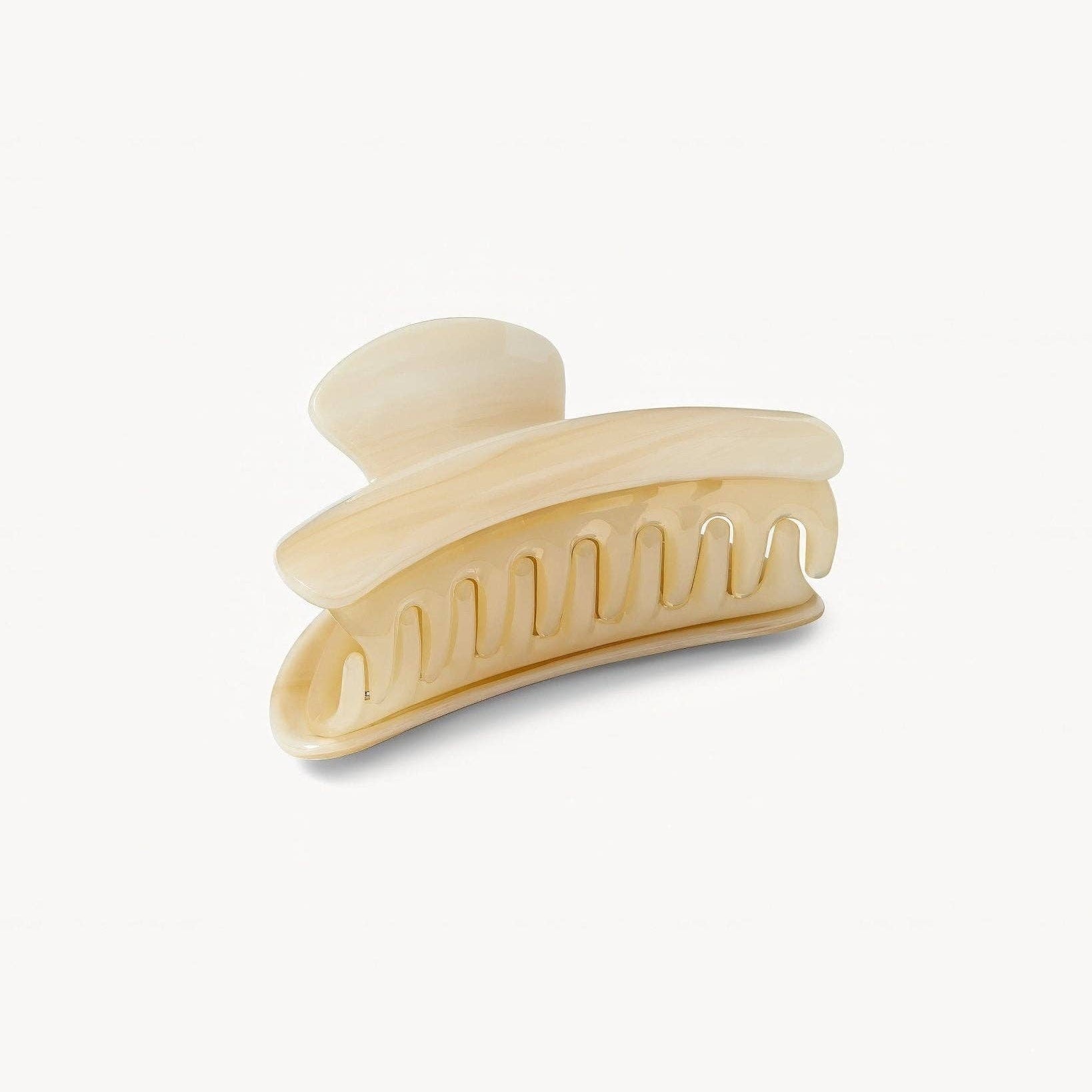 Beige hair clip on a white background