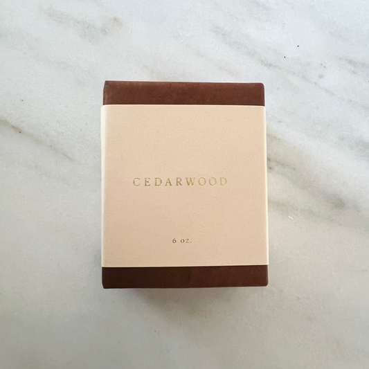 Cedarwood product packaging on a marble surface