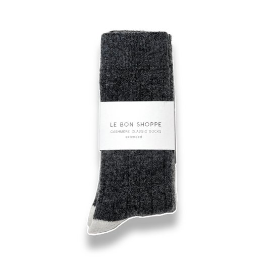 A pair of dark charcoal gray heathered knit socks with a white paper band label reading 'LE BON SHOPPE', photographed on a clean white background.