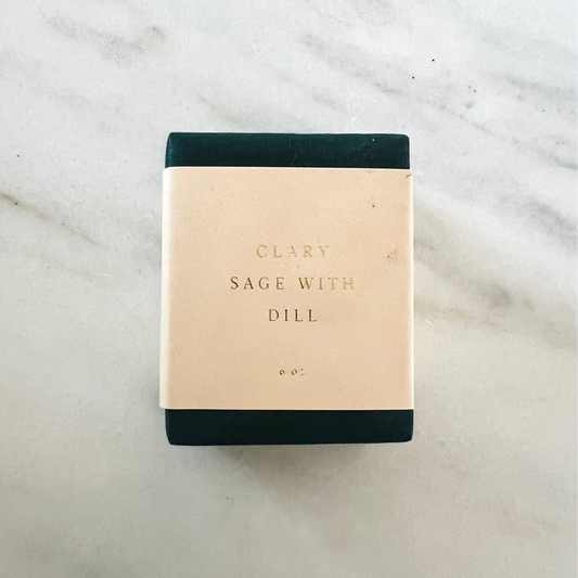 Bar of soap with 'Clary Sage with Dill' text on a marble surface